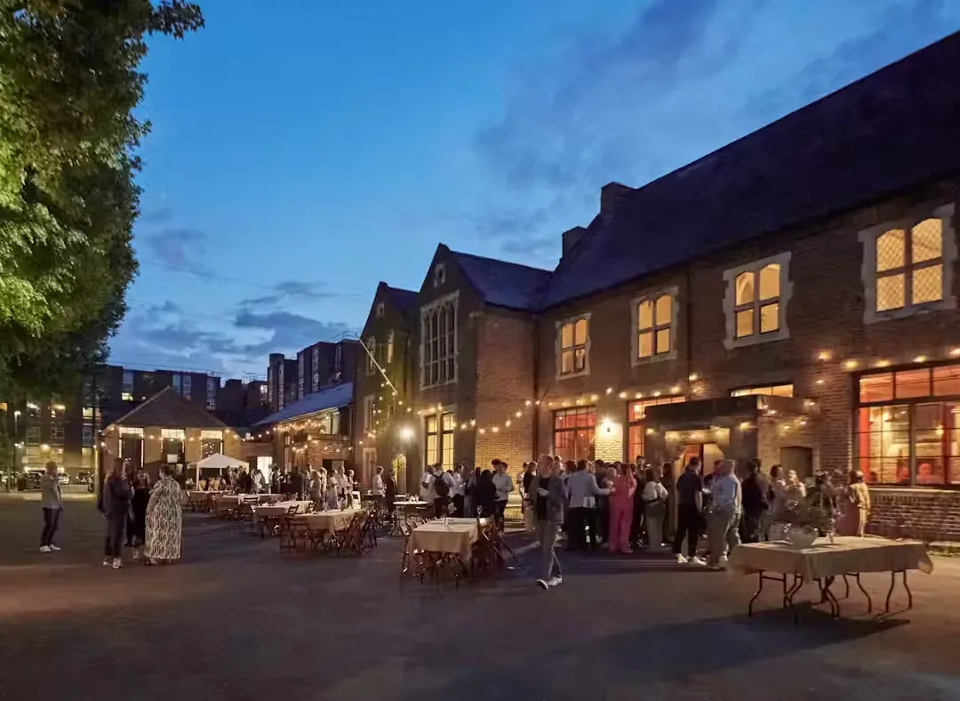 The courtyard at Columbia Road strung with festoon lighting